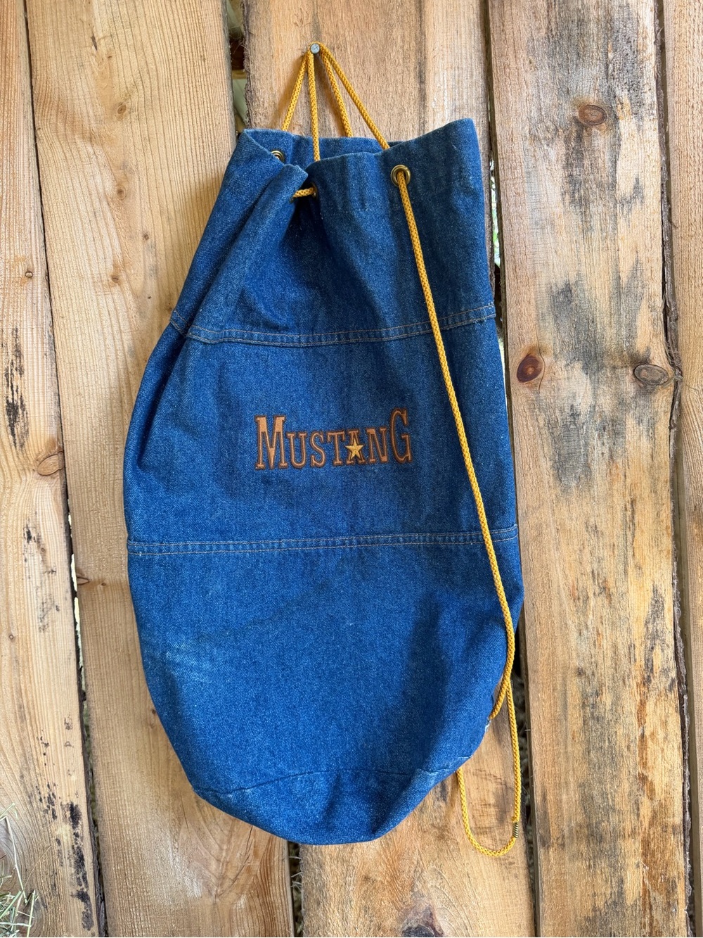 Mustang Denim Drawstring Backpack in Blue with Yellow Cord